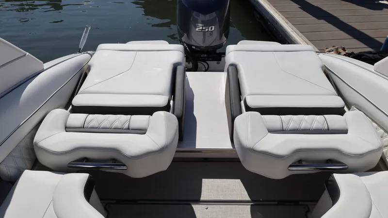 Slide: The Image of 2022 Regal LX4 boat with white leather seating and 250 horsepower engine. - 20