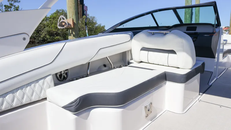 Slide: The Image of 2022 Regal LX4 boat interior with white and black seating, modern design. - 26
