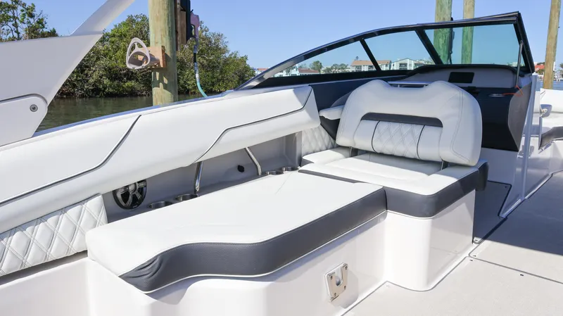 Slide: The Image of 2022 Regal LX4 boat interior with luxurious seating and modern design. - 27