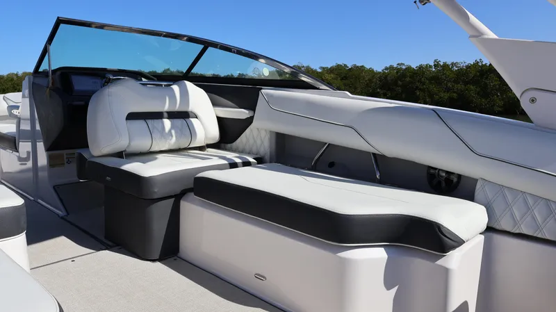 Slide: The Image of 2022 Regal LX4 boat interior with luxurious seating and modern design. - 32