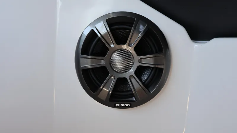 Slide: The Image of Speaker on a 2022 Regal LX4 boat, featuring a Fusion audio system. - 34