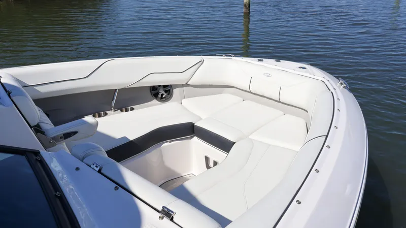 Slide: The Image of 2022 Regal LX4 boat with spacious seating on calm water. - 47