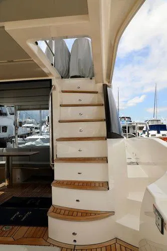 Slide: The Image of Staircase on 2019 Absolute 50 Fly yacht with marina view in background. - 12
