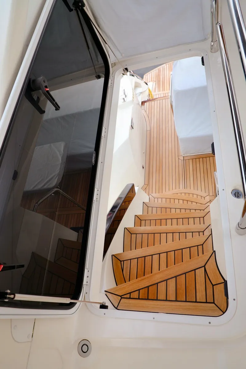 Slide: The Image of Staircase on 2019 Absolute 50 Fly yacht with sleek wooden design. - 13