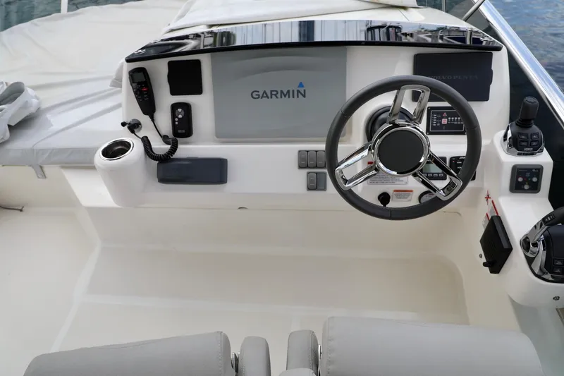 Slide: The Image of 2019 Absolute 50 Fly yacht helm with Garmin navigation system and modern controls. - 16