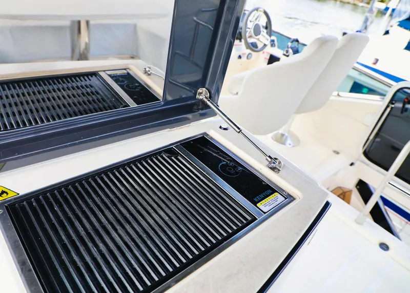 Slide: The Image of Outdoor grill and seating area on a 2019 Absolute 50 Fly yacht. - 24