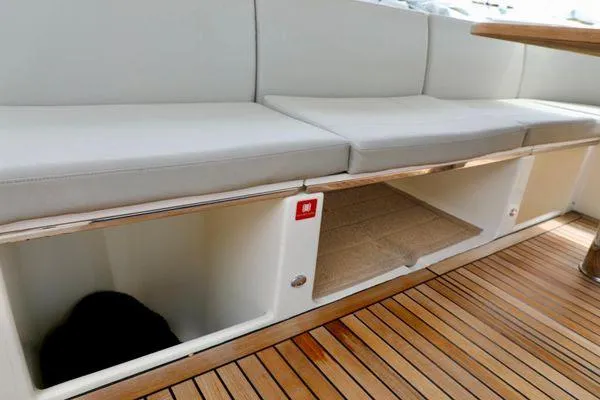 Slide: The Image of Luxurious seating and storage on 2019 Absolute 50 Fly yacht with wooden flooring. - 28