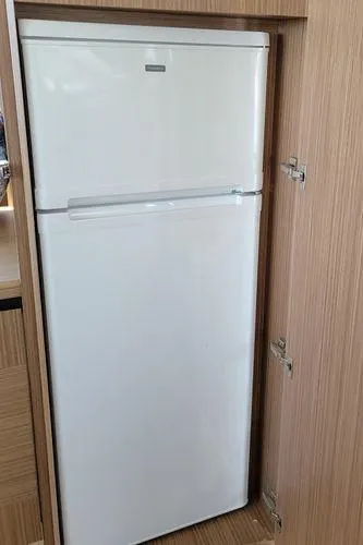 Slide: The Image of White refrigerator in wooden cabinet on 2019 Absolute 50 Fly yacht. - 30