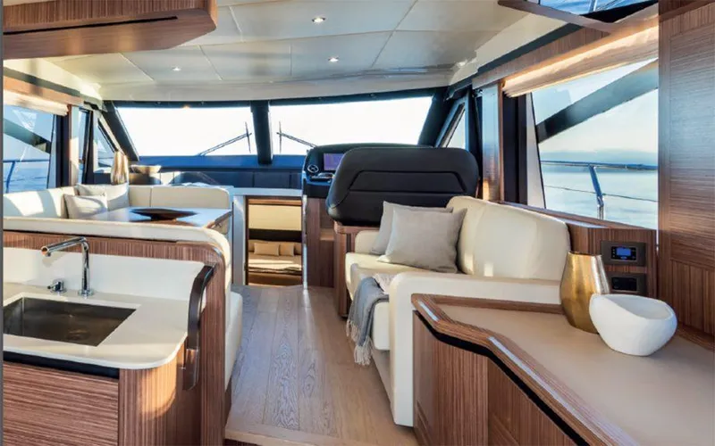 Slide: The Image of Luxurious interior of 2019 Absolute 50 Fly yacht with modern furnishings and panoramic windows. - 32
