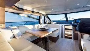 Slide: The Image of Luxurious interior of 2019 Absolute 50 Fly yacht with elegant seating and panoramic windows. - 33