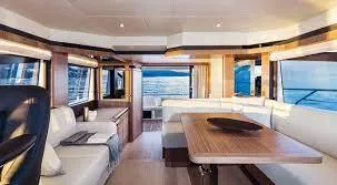 Slide: The Image of Luxurious interior of 2019 Absolute 50 Fly yacht with elegant seating and panoramic windows. - 34