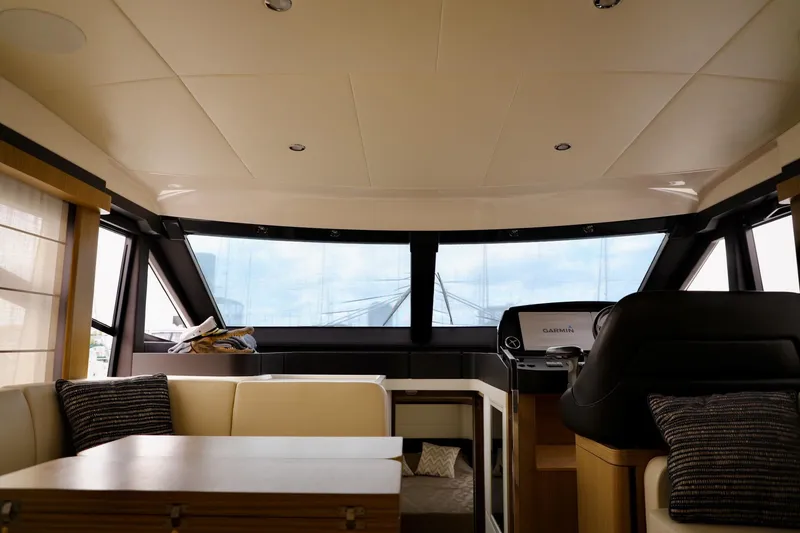 Slide: The Image of Interior of 2019 Absolute 50 Fly yacht, featuring modern seating and helm station. - 43
