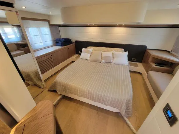 Slide: The Image of Luxurious bedroom interior of 2019 Absolute 50 Fly yacht with modern design and cozy bedding. - 47