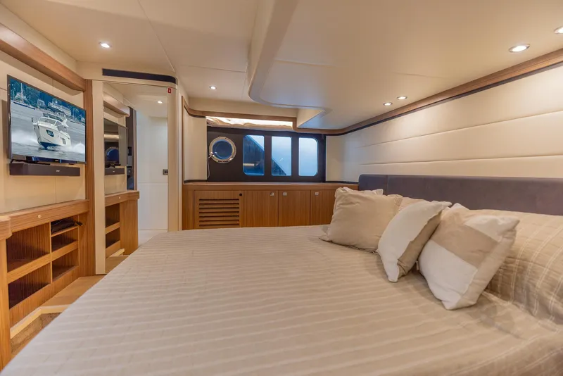 Slide: The Image of Luxurious bedroom interior of 2019 Absolute 50 Fly yacht with modern amenities. - 49