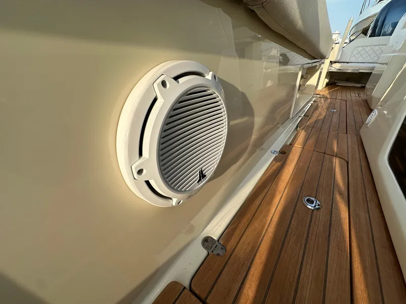 Slide: The Image of A speaker is mounted on the side wall of a Chris-Craft Catalina 34 boat. - 29
