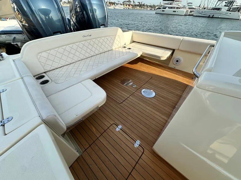 Slide: The Image of The image shows the cockpit of a 2021 Chris-Craft Catalina 34 with elegant upholstery and wooden flooring. - 6
