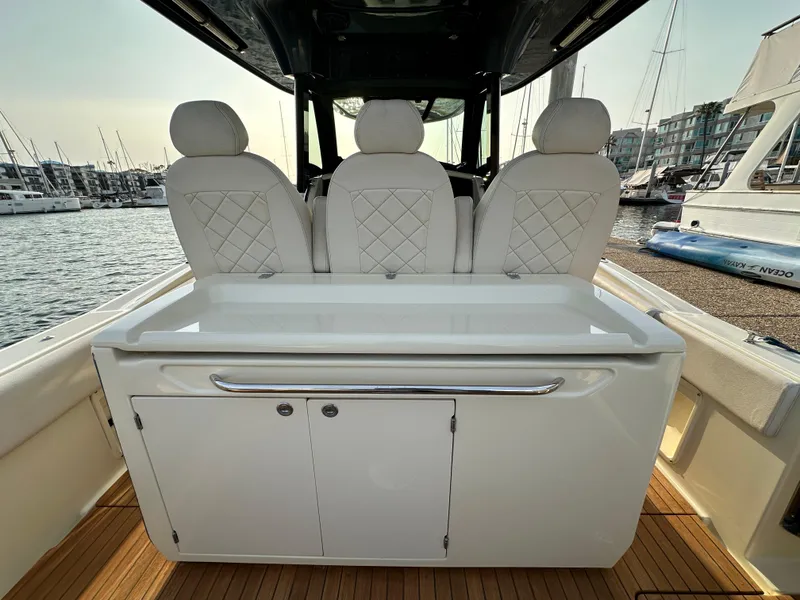Slide: The Image of The image shows the cockpit of a 2021 Chris-Craft Catalina 34 with elegant seating. - 8
