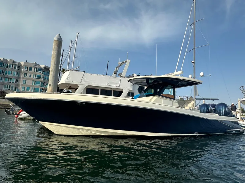 The Image of A 2021 Chris-Craft Catalina 34 is in the water. It features a sleek, modern design. - 0