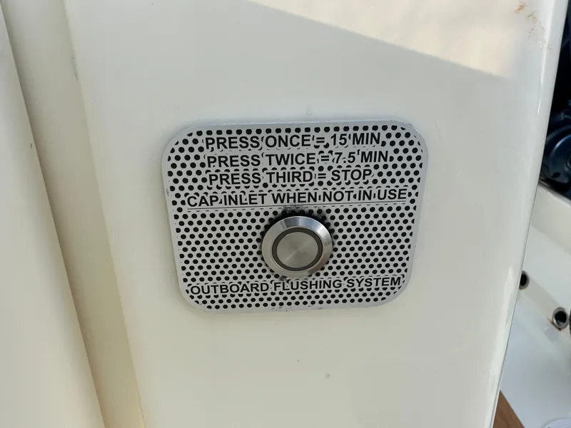 Slide: The Image of A control panel with instructions for the outboard flushing system. - 33