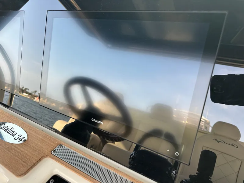 Slide: The Image of A Garmin screen on a Chris-Craft Catalina 34 boat, with a steering wheel in the background. - 15