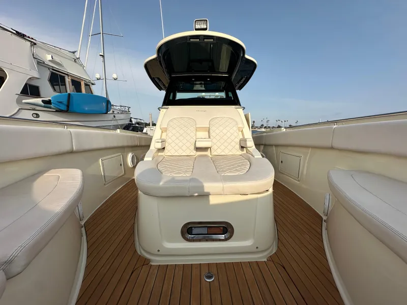 Slide: The Image of The image shows the deck of a 2021 Chris-Craft Catalina 34 with elegant seating and wooden flooring. - 23