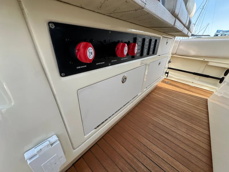 Slide: The Image of The image shows the cockpit of a 2021 Chris-Craft Catalina 34 with wood flooring and control panels. - 18