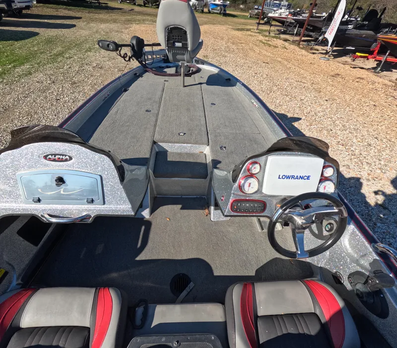 Slide: The Image of 2013 Legend Boats A211 interior with steering wheel and Lowrance electronics. - 8