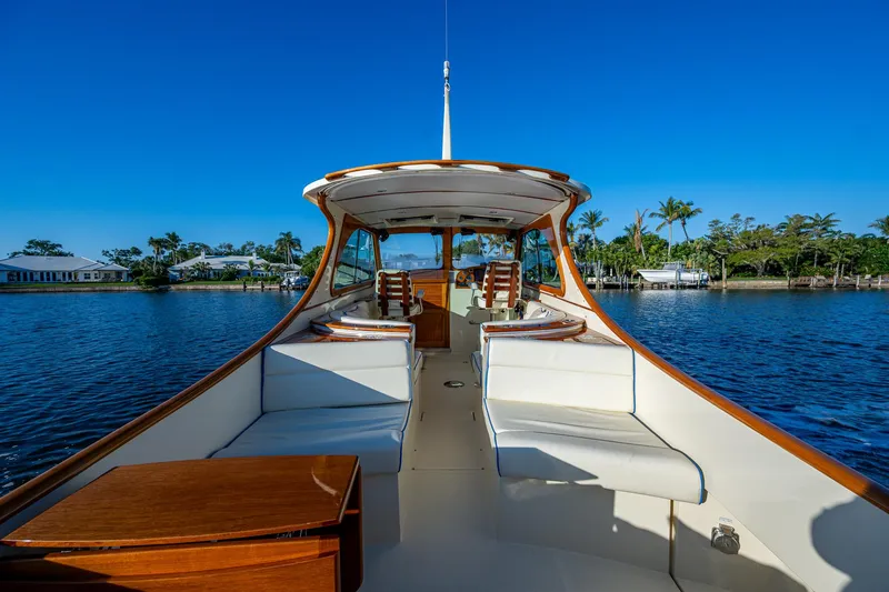 Slide: The Image of 2016 Hinckley Talaria 34 yacht on calm water, clear blue sky background. - 10