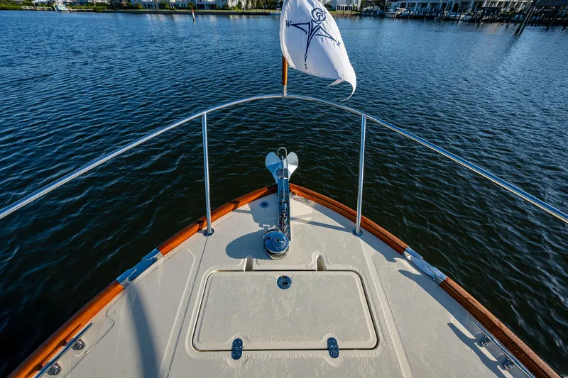 Slide: The Image of Bow view of 2016 Hinckley Talaria 34 yacht on calm water. - 28