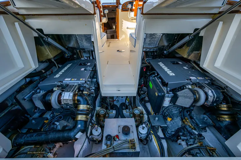 Slide: The Image of Engine room of a 2016 Hinckley Talaria 34, showcasing dual inboard engines. - 31