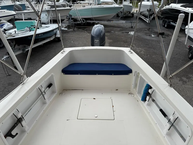 Slide: The Image of 2015 Atlas Boat Works Pompano 23 interior with seating and outboard motor. - 10