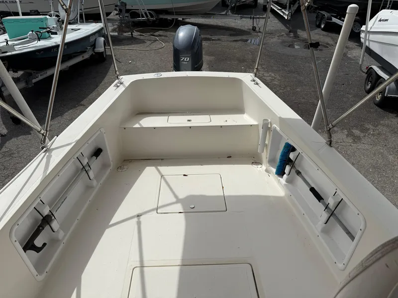 Slide: The Image of 2015 Atlas Boat Works Pompano 23 interior, showcasing spacious deck and storage compartments. - 11