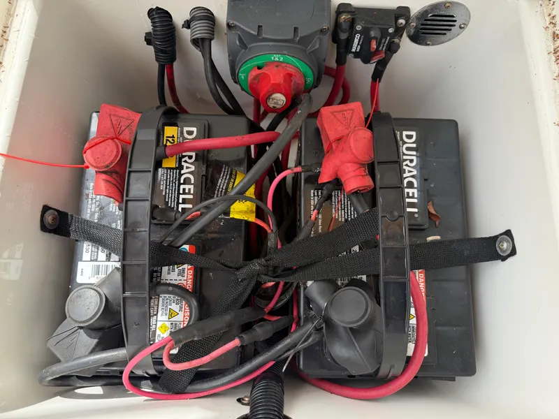 Slide: The Image of Battery compartment of 2015 Atlas Boat Works Pompano 23 with Duracell batteries and wiring. - 14