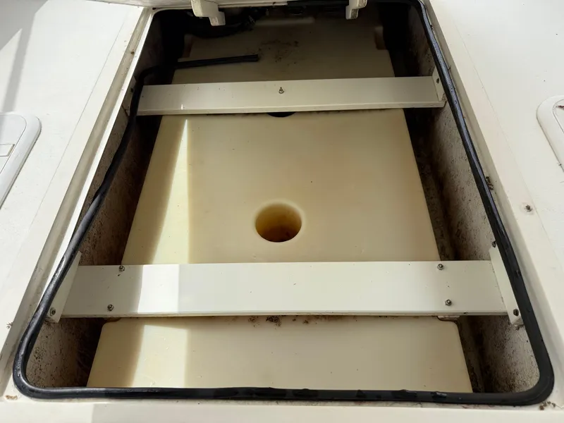 Slide: The Image of Storage compartment of 2015 Atlas Boat Works Pompano 23, open and empty. - 19