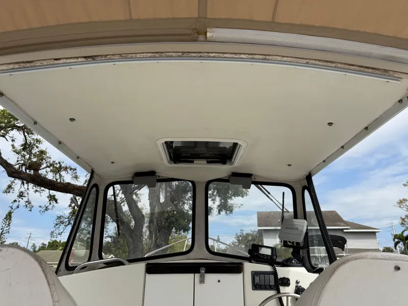 Slide: The Image of Interior view of 2015 Atlas Boat Works Pompano 23 cabin with steering console. - 27