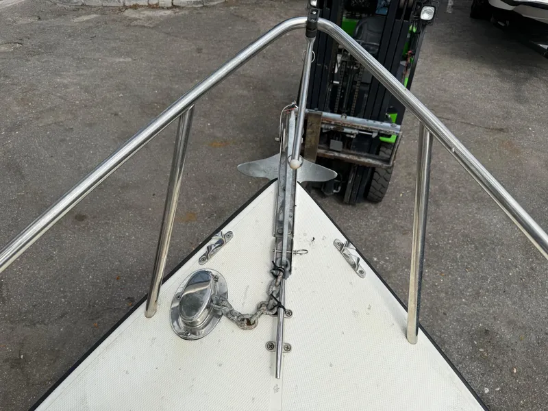 Slide: The Image of Bow of 2015 Atlas Boat Works Pompano 23 with anchor and railing. - 33