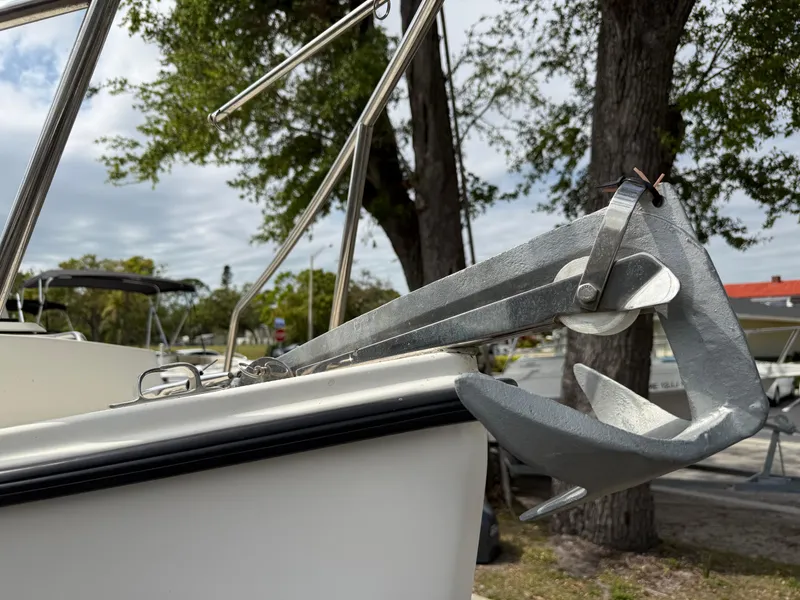 Slide: The Image of 2015 Atlas Boat Works Pompano 23 with anchor, docked outdoors. - 35