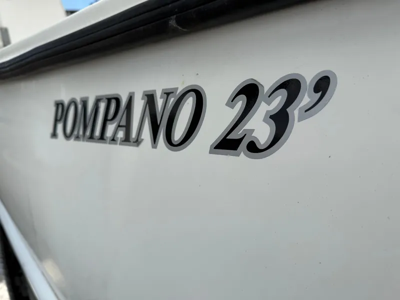 Slide: The Image of 2015 Atlas Boat Works Pompano 23 model name on boat hull. - 8