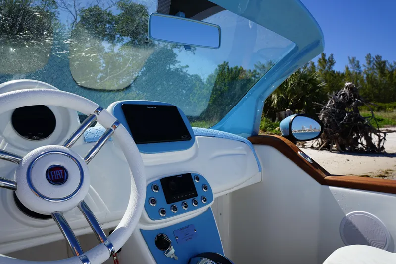 Slide: The Image of Interior of 2025 Car Off-shore Fiat 500 Classic, featuring sleek design and modern controls. - 10