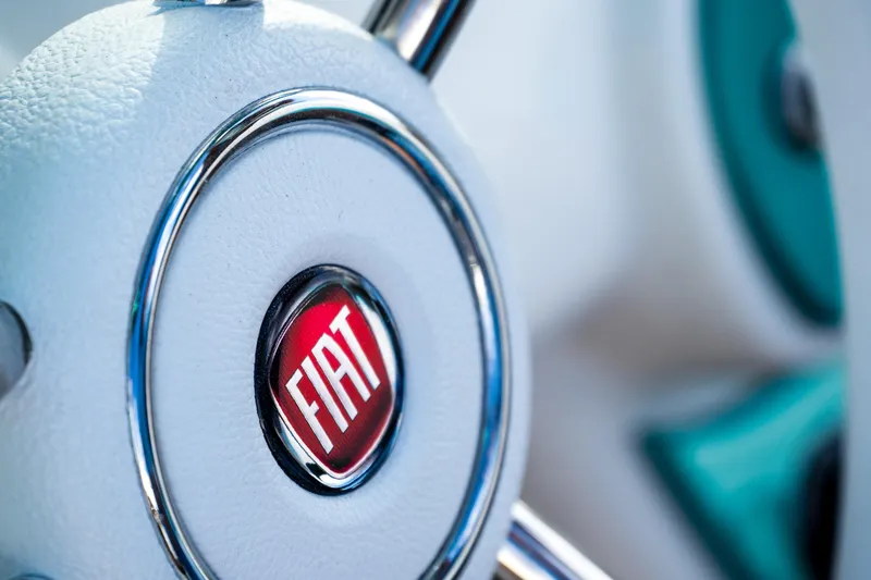 Slide: The Image of Close-up of 2025 Fiat 500 Classic steering wheel with logo detail. - 17