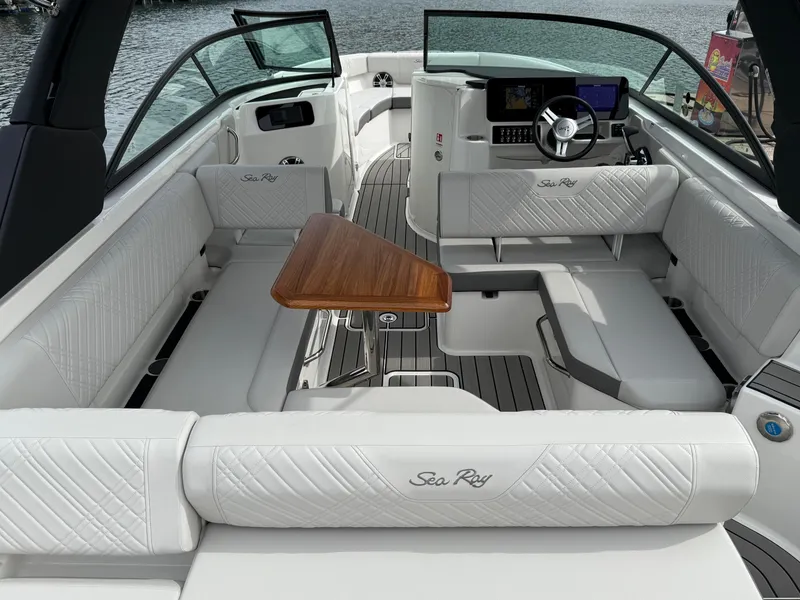 Slide: The Image of 2025 Sea Ray SDX 250 boat interior with luxurious seating and sleek design. - 4