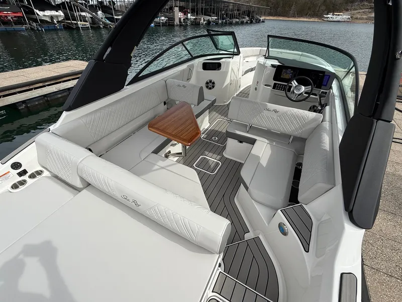 Slide: The Image of 2025 Sea Ray SDX 250 boat interior with sleek seating and modern dashboard. - 5