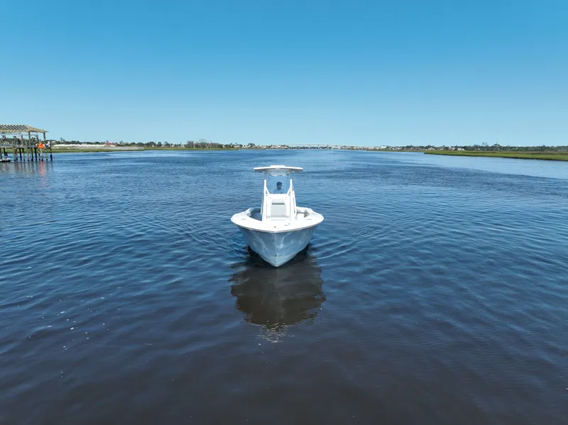Slide: The Image of 2023 Front Runner 26 Center Console boat on open water under clear blue sky. - 11