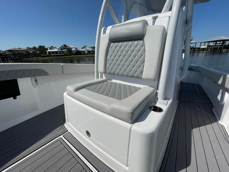 Slide: The Image of 2023 Front Runner 26 Center Console boat with cushioned seating and sleek design. - 17