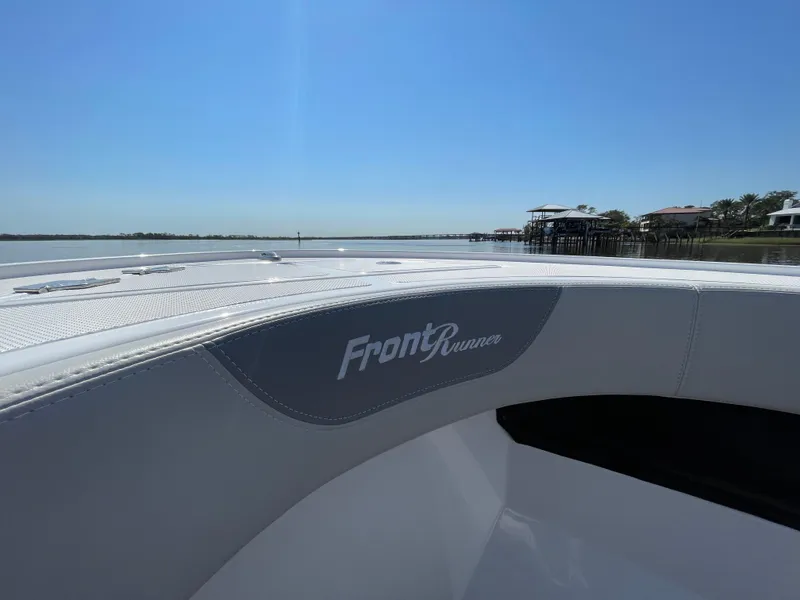 Slide: The Image of 2023 Front Runner 26 Center Console boat on calm water, showcasing sleek design. - 19