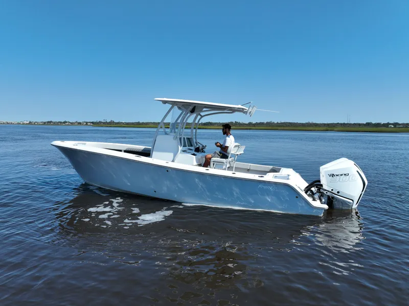 Slide: The Image of 2023 Front Runner 26 Center Console boat on calm water, side view. - 2