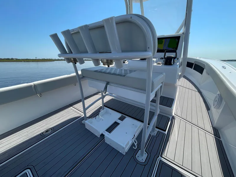 Slide: The Image of 2023 Front Runner 26 Center Console boat interior with sleek seating and modern design. - 23