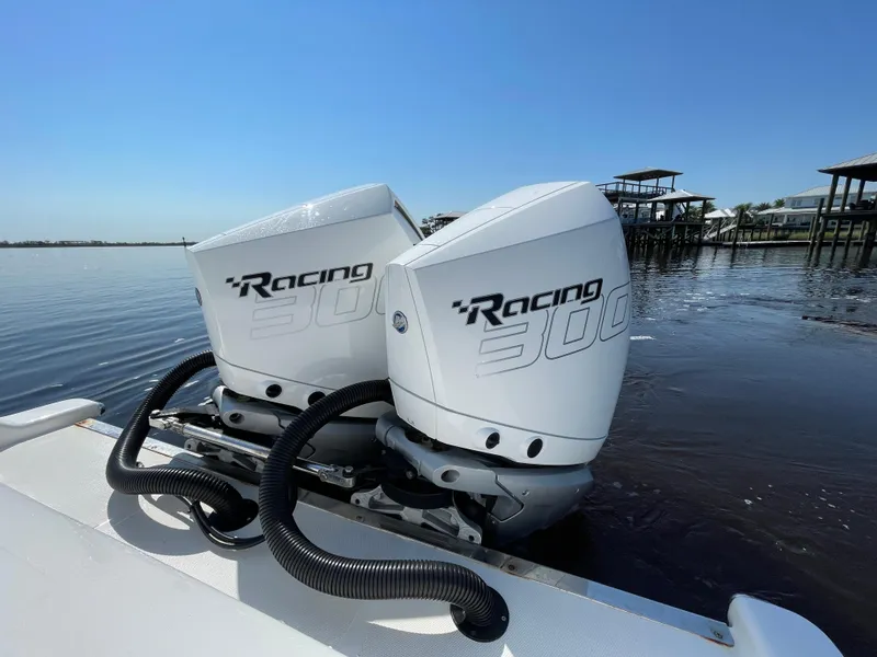 Slide: The Image of Twin Racing 300 outboard engines on 2023 Front Runner 26 Center Console boat. - 24