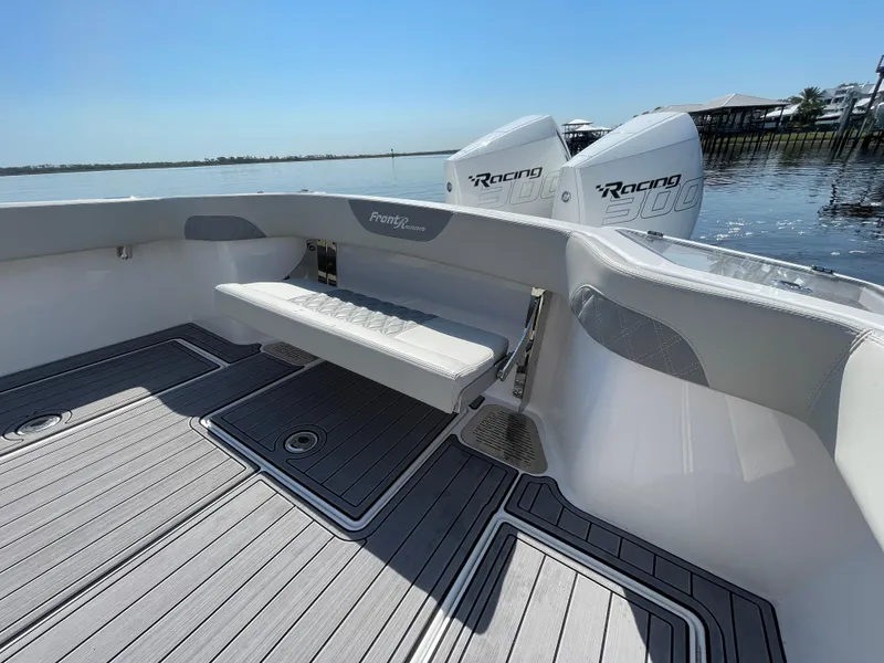 Slide: The Image of 2023 Front Runner 26 Center Console boat with dual Racing engines on calm water. - 28