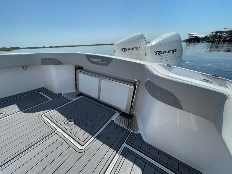 Slide: The Image of 2023 Front Runner 26 Center Console boat with dual Racing engines on calm water. - 29